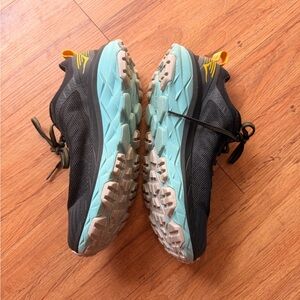 Hoka One One Black Running Shoes with Teal Logo and Yellow Stitching